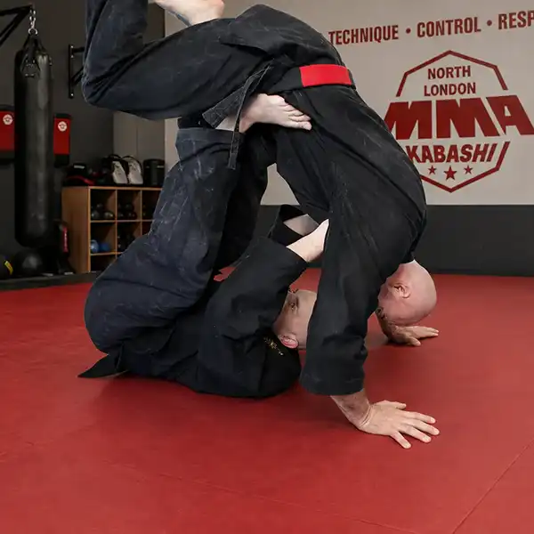 Boxing stance adapted for MMA takedown awareness